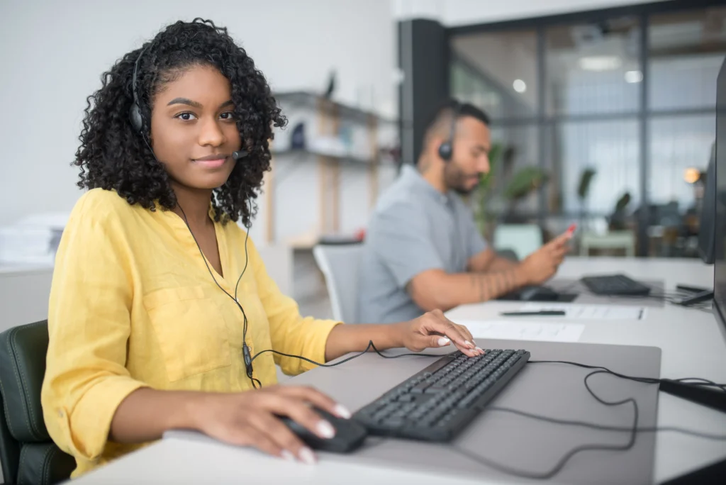 OnlineSafeGuide support agent with headset at desk